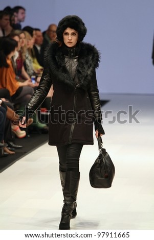 TORONTO - MARCH 15: A model walks the runway in the Rudsak runway show for the Fall/Winter 2012 season at Toronto's World Mastercard Fashion Week on March 15. 2012 in Toronto, Canada..