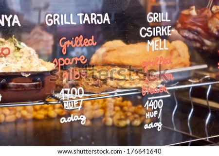 Grilled ribs and chicken breast; foods at a christmas fair