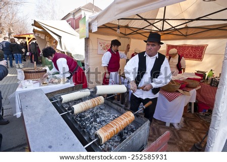 MOHACS, HUNGARY - FEBRUARY 14: Baker make traditional Hungarian cake at the carnival of funeral the winter on February 14, 2015 in Mohacs, Hungary.