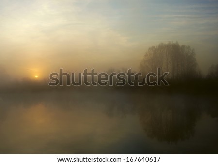 Cold sunrise at an autumn lake