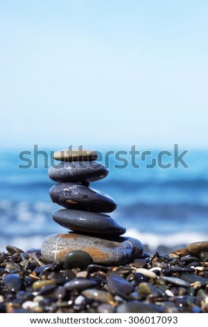 Stack of round smooth stones on the seashore