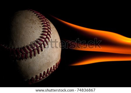 Flaming fire fast baseball pitch against a black background