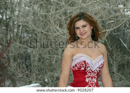 teenage girl standing in cold wind in formal dress
