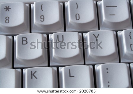 Computer keyboard with the word buy spelt on the keys