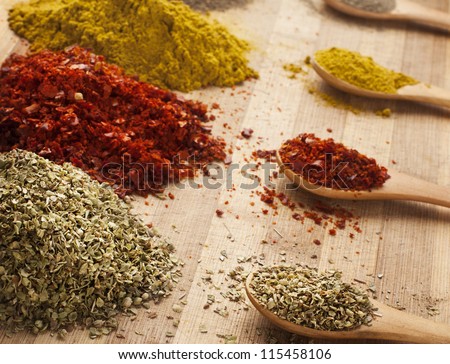 various spices on cutting board with shallow depth of field