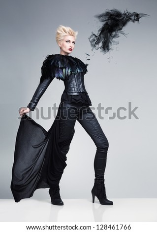 futuristic model like a bird and a raven made of dark smoke on a white platfrom