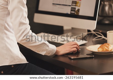 filtered photo of a young woman working in an office