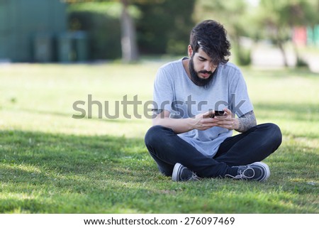 hipster guy with tattooed arm using a laptop.focus on keyboard