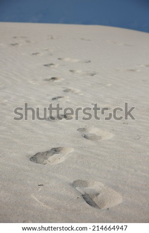 Footprints in sand, white beach, Soqotra island, Yemen.