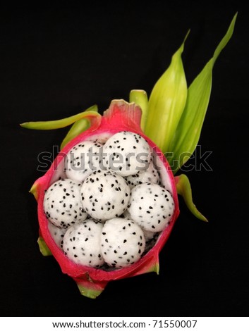 carved dragon fruit balls in dragon fruit skin