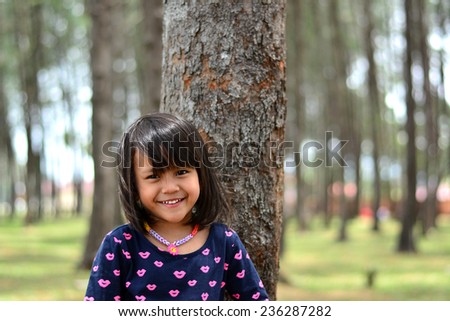 Cute girl pose smile in nature forest park