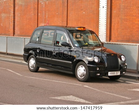 LONDON - JULY 9 : A London Taxi or \'Black Cab\' at Waterloo on July 9, 2013 in London, UK. All London cabs undergo a strict annual mechanical test before they are allowed to ply for hire.