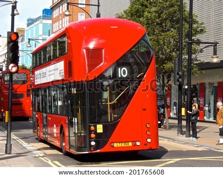 LONDON - JUNE 26. The hybrid \'New Bus For London\' is now in service on several London bus routes. It is 50% more fuel efficient than existing diesel buses. June 26 2014 in London.