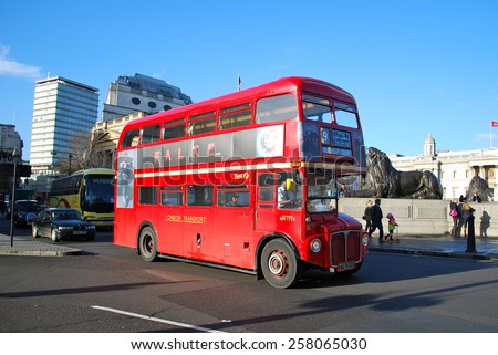 LONDON - MARCH 5: Routemaster Bus operating in London on March 5, 2015 in London, UK. The open platform facilitated speedy boarding under the supervision of a conductor.