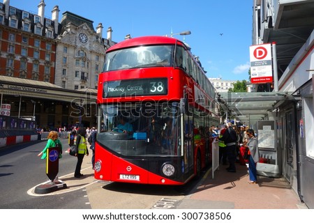 LONDON - JULY 26: A London bus at Victoria Station, London. London buses are increasingly fuel efficient. July 26, 2015 in London.