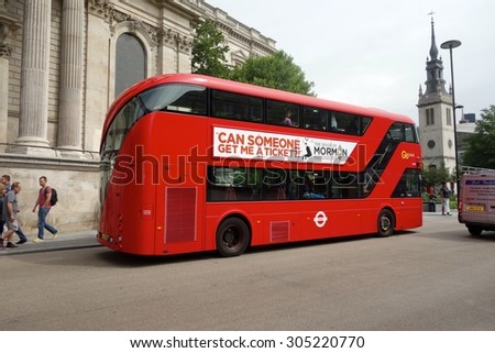 LONDON - AUGUST 11: A London bus at St Paul's, London. London buses are increasingly fuel efficient. August 11, 2015 in London.
