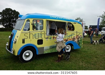 Edenbridge, Kent, England - AUGUST 30: Vintage ice cream van dispensing ices to visitors to the Edenbridge & Oxted Agricultural Show, Edenbridge, Kent, England. August 30, 2015 in Edenbridge, England.