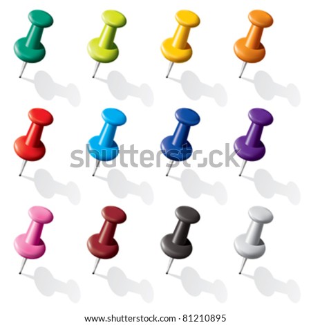 The pins of various colors on a white background with gray shadows.