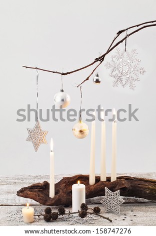 Christmas candles and handmade decorations on white