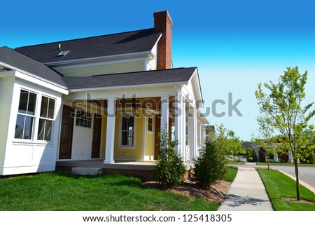 Yellow Suburban American New England Style Dream Home with Large Front Porch