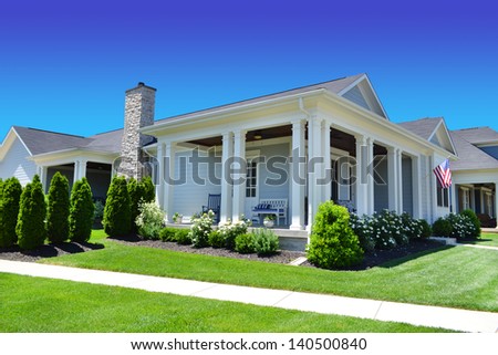 Beautiful, New Suburban Dream Home with a Large Front Porch in the Summertime