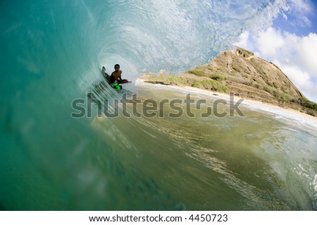 bodyboarder deep in the tube of a giant wave (for editorial use only)