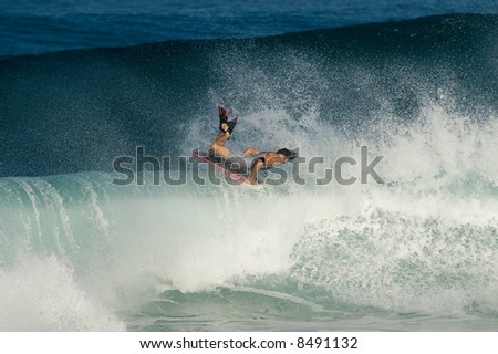 professional surfer at a contest (for editorial use only)