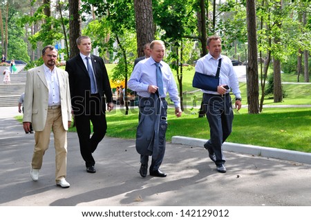 BUCHA, UKRAINE - 31 MAY 2013: The president of Ukraine Leonid Kuchma, major of Bucha town Anatoliy Fedoruk and unknown persons meet for opening of vocal festival on May 31, 2013 in Bucha, Ukraine.