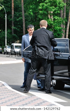 BUCHA, UKRAINE - 31 MAY 2013: The unknown bodyguards meet the VIP person on May 31, 2013 in Bucha, Ukraine.
