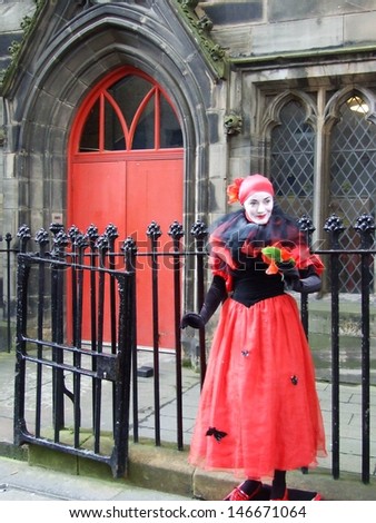 GLASGOW Ã¢Â?Â? CIRCA AUGUST 2007: Unknown woman plays the role of mime at week-end street festival on August 2007 in Glasgow, Great Britain.