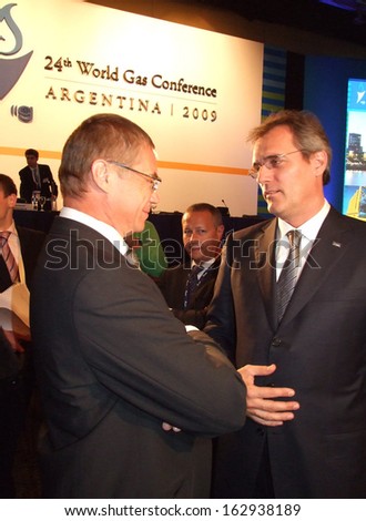 BUENOS AIRES, ARGENTINA - 5-9 OCTOBER 2009: The top-manager of Gazprom A.Medvedev speaks with unknown manager of E-On on the 24th World Gas Conference on October 5-9, 2009 in Buenos Aires, Argentina.
