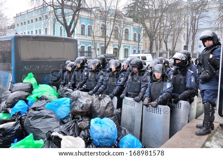 KIEV, UKRAINE Ã¢Â?Â? 18 DECEMBER 2013: Unknown police officers guard the building of government on Ukrainian revolution on December 18, 2013 in Kiev, Ukraine.