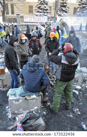 KIEV, UKRAINE - 24 JANUARY 2014: Unknown demonstrators rest after street fights on January 24, 2014 in Kiev, Ukraine