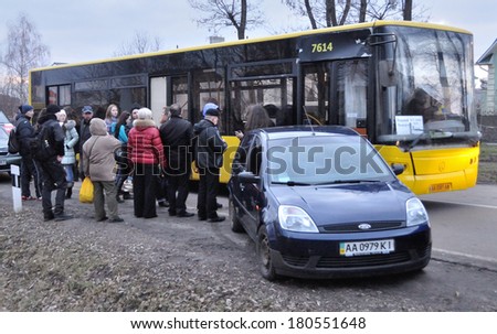 MEZHIGIRJA, UKRAINE - CIRCA FEBRUARY 2014: Unknown people take place in bus to the residence of Ukrainian former president Viktor Yanukovych circa February 2014 in Mezhigirja, Ukraine