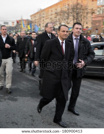 KIEV, UKRAINE - 22 FEBRUARY 2013: Minister of foreign affairs of Poland Radoslaw Sikorski and ambassdor Henrik Litvin with bodyguards walk on city street on February 22, 2013 in Kiev, Ukraine
