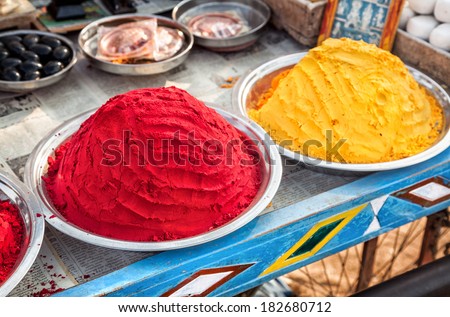 Colorful painting powders and souvenirs at Hampi bazaar