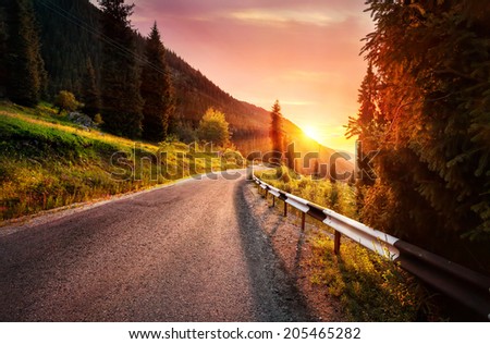Road in the mountains at sunset in Kazakhstan