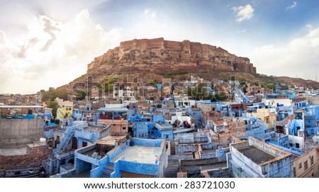 Blue city and Mehrangarh fort on the hill at sunset sky in Jodhpur, Rajasthan, India