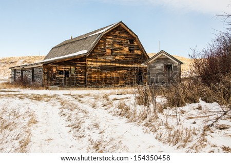 Built to look like a barn due to the agricultural area it is in, this community hall and outhouse are the last remaining structures in a small, rural Montana town
