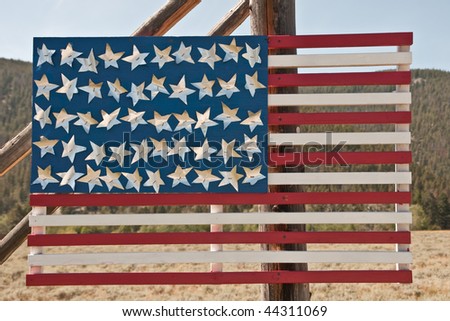 American flag made of wood with stars stapled on