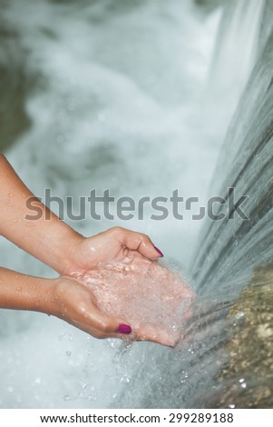 Care water in your hands in the world on nature