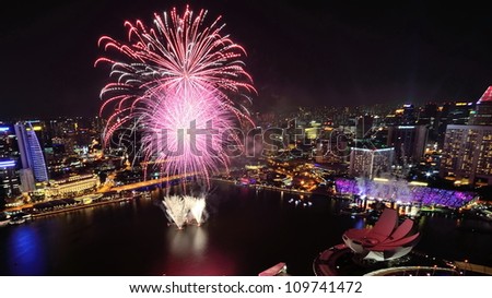 SINGAPORE - AUGUST 4: Aerial view of fireworks display from Marina Bay Sands during National Day Parade Singapore 2012 Preview on August 4, 2012 in Singapore.