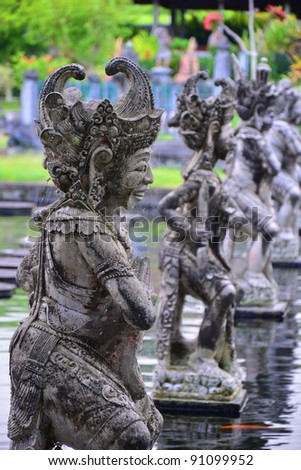 Balinese statue in Water Palace of Tirta Gangga in East Bali