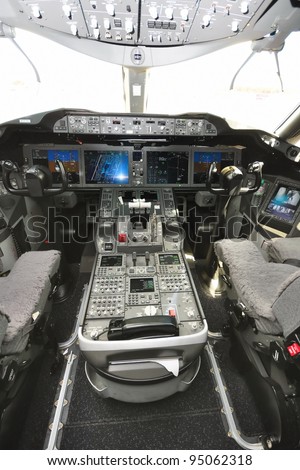 SINGAPORE - FEBRUARY 12: Interior of the cockpit with control panel and throttle in the new Boeing 787 Dreamliner at Singapore Airshow February 12, 2012 in Singapore
