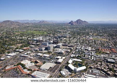 Aerial view of financial district under desert skies