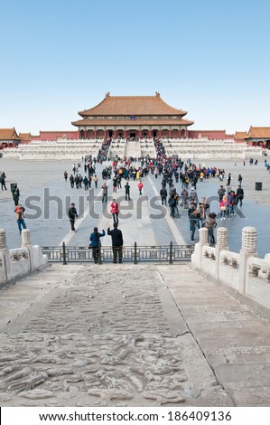 BEIJING, CHINA - MARCH 28: Chinese and foreign tourists walks in front of Hall of Supreme Harmony (Taihedian) on the Outer Court of Frobidden City on March 28, 2013 in Beijing
