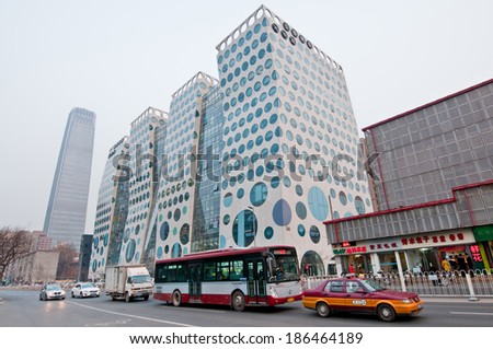 BEIJING, CHINA - MARCH 30: Guanghualu SOHO building at Guanghua Rd with China World Trade Center Tower 3 on background, Central Business District (CBD), Chaoyang District on March 30, 2013 in Beijing