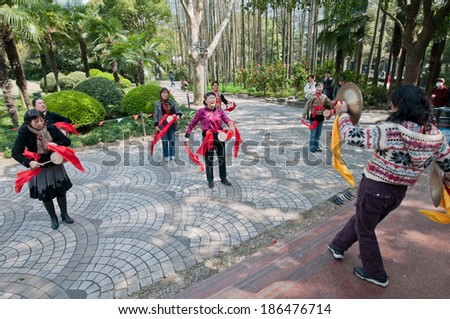 SHANGHAI, CHINA - MARCH 21: Chinese women dances during music performance with YaoGu drums in Huangpu District on March 21, 2013 in Shanghai