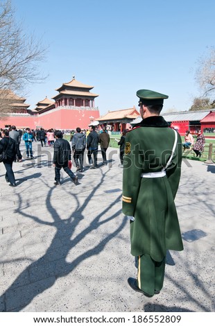BBEIJING, CHINA - MARCH 27: Chinese soldier stands on guard near Meridian Gate (Wumen) in Forbidden City on March 27, 2013 in Beijing