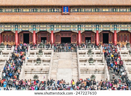 BEIJING, CHINA - MARCH 28: Chinese and foreign tourists in front of Hall of Supreme Harmony (Taihedian) on the Outer Court of Frobidden City on March 28, 2013 in Beijing